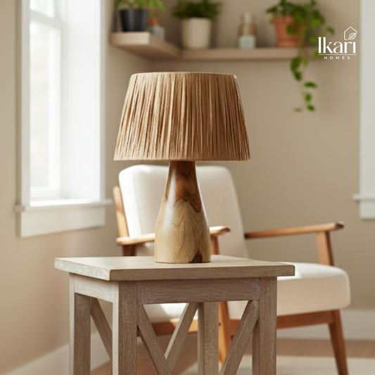 Wooden table lamp on a wooden table with a blurred background of a room.