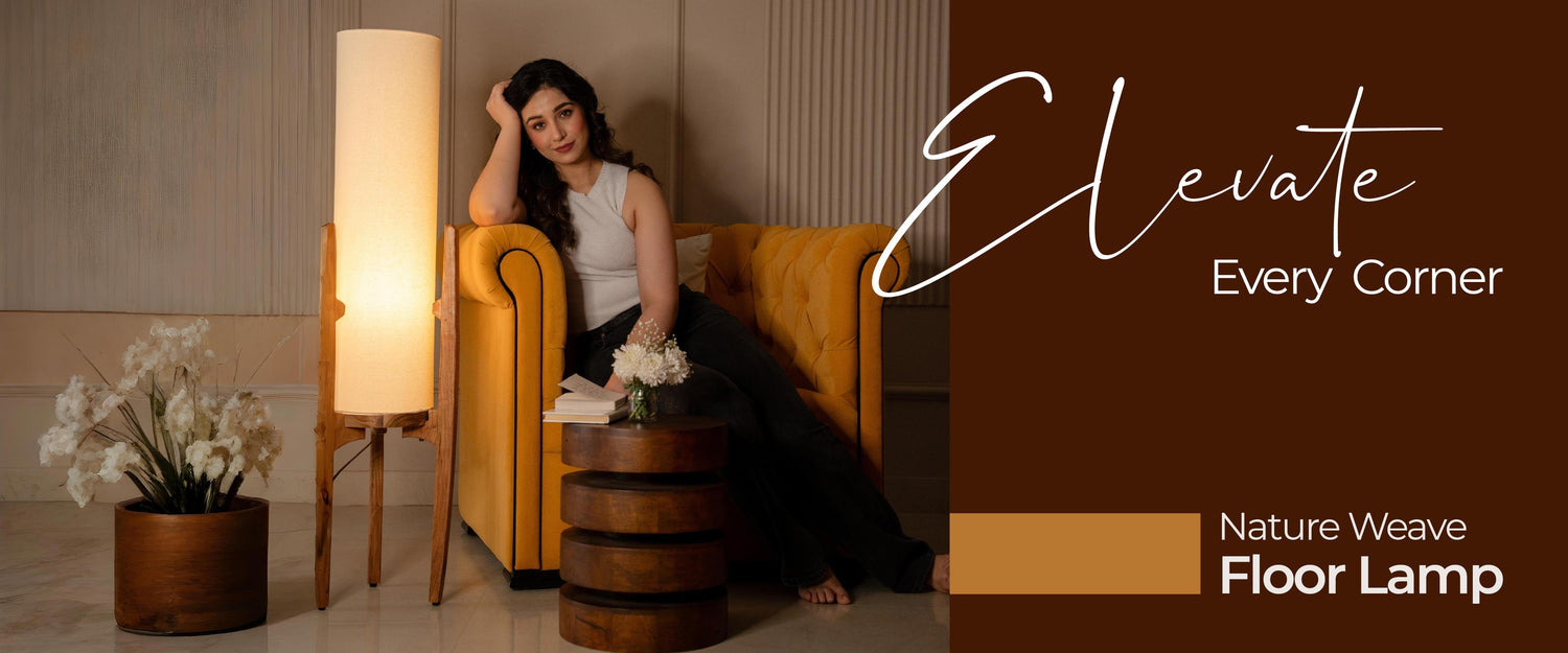 Woman sitting on a yellow couch with a floor lamp and decorative elements in a living room setting.