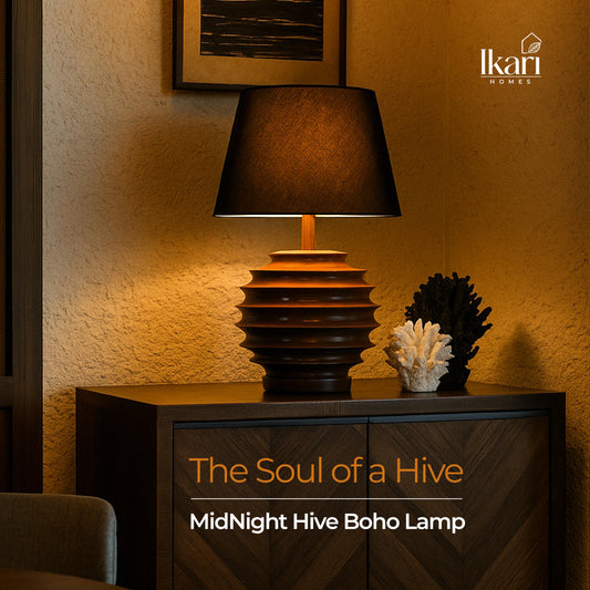 Decorative lamp on a wooden cabinet with warm lighting and 'Ikari Homes' branding.