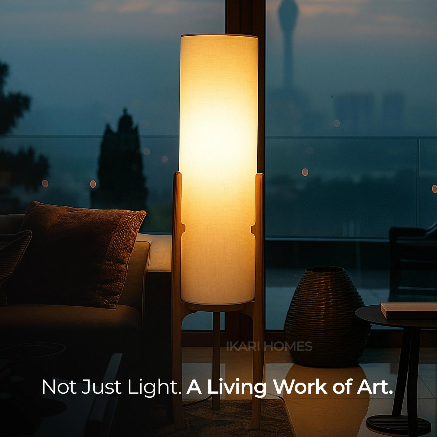 Floor lamp casting a warm glow in a dimly lit room with 'Ikari Homes' branding.