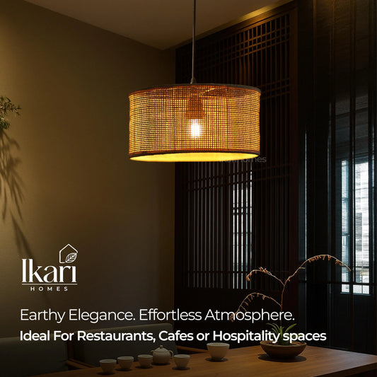 Woven pendant light fixture in a dimly lit room with 'Ikari Homes' branding.